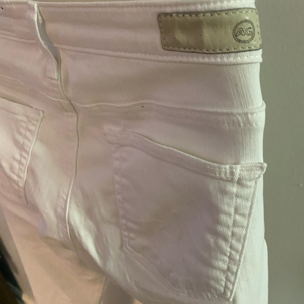 White Skinny Leg Jeans with Fringed Bottoms